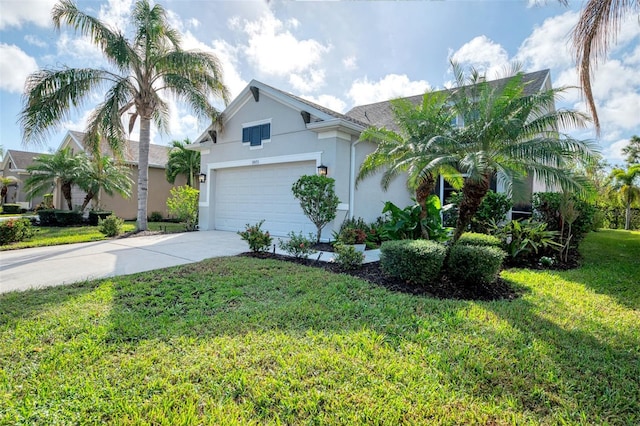 view of front of property with a front lawn and a garage