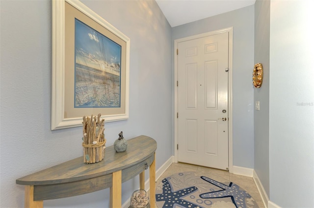 entrance foyer with light tile patterned floors