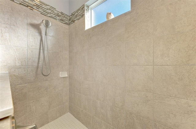 bathroom with tiled shower