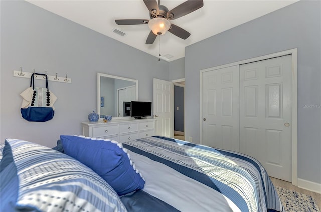 bedroom with ceiling fan and a closet