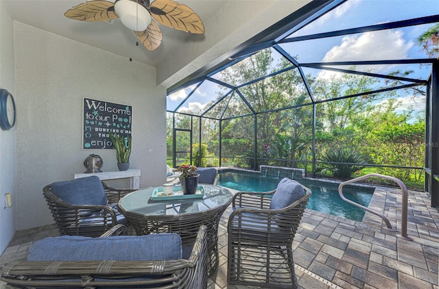 view of patio with pool water feature, ceiling fan, and a lanai