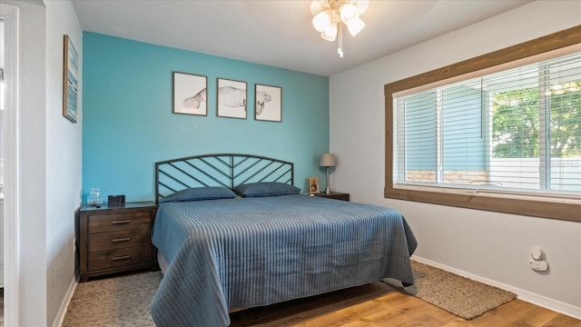 bedroom featuring light hardwood / wood-style flooring and ceiling fan