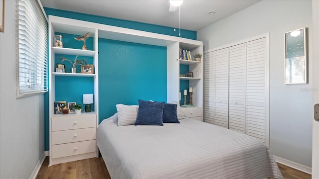 bedroom with hardwood / wood-style floors and ceiling fan