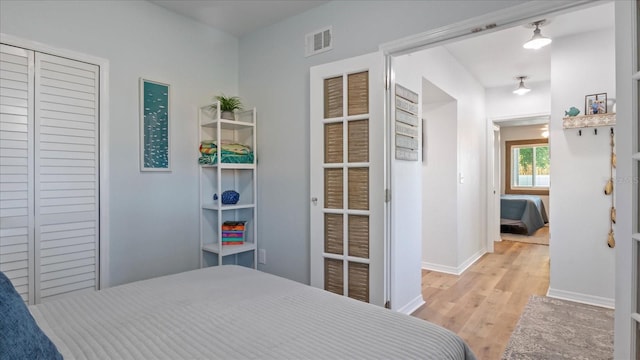 bedroom with light wood-type flooring