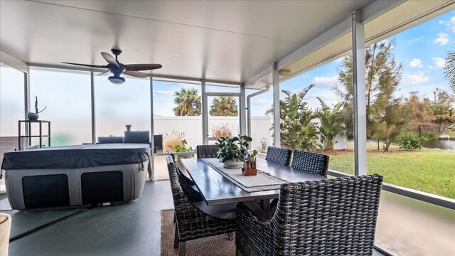 sunroom featuring ceiling fan