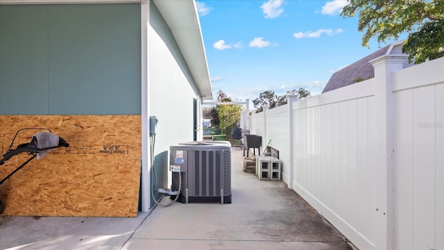 view of side of property featuring central air condition unit