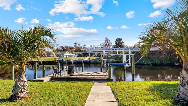 dock area featuring a yard and a water view