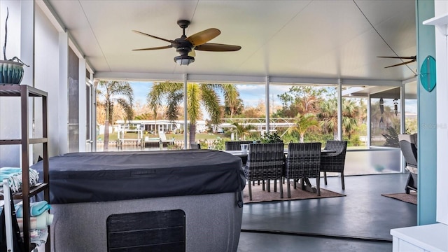 sunroom with a wealth of natural light and ceiling fan