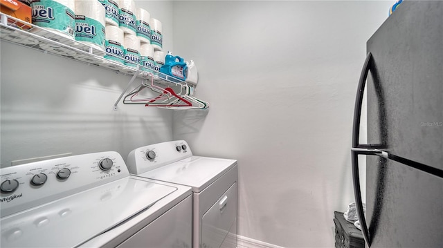 laundry room featuring separate washer and dryer