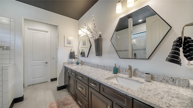 bathroom featuring vanity and hardwood / wood-style flooring