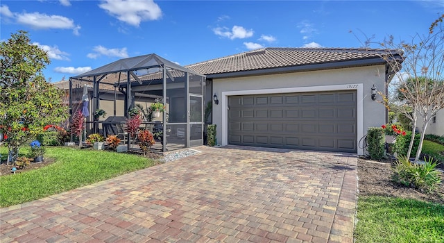 view of front of house with glass enclosure and a garage