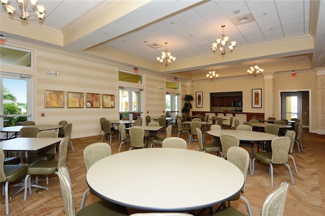 dining space featuring plenty of natural light and ornamental molding