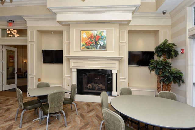 dining space with ornamental molding