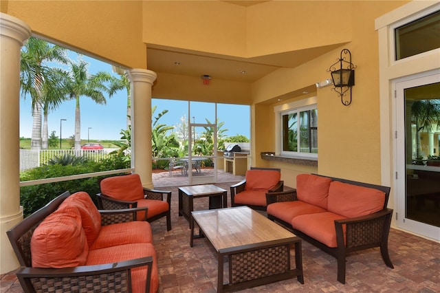 view of patio / terrace featuring an outdoor living space and exterior kitchen