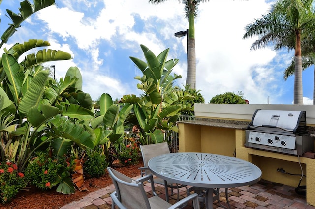 view of patio featuring a grill and exterior kitchen