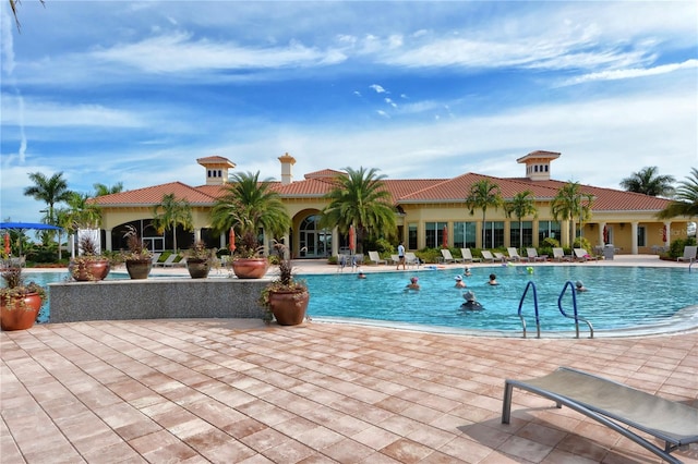 view of swimming pool featuring a patio area