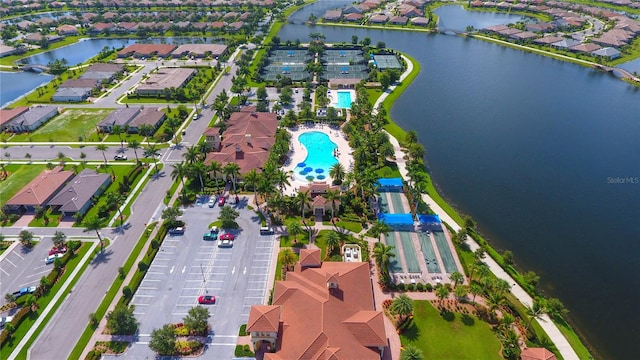 birds eye view of property with a water view