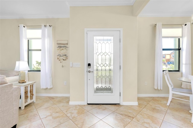 tiled foyer with ornamental molding