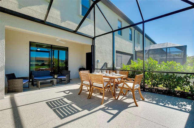 view of patio with glass enclosure and an outdoor living space