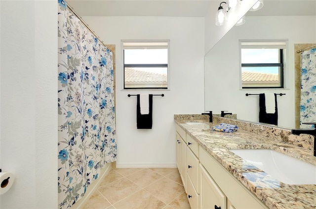 bathroom featuring a shower with shower curtain, vanity, and tile patterned floors