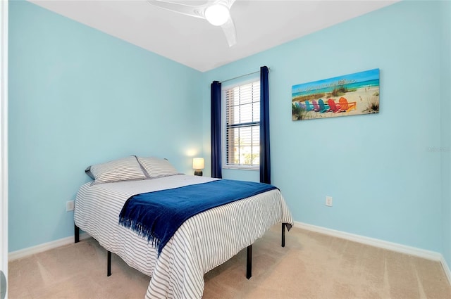 bedroom featuring ceiling fan and light colored carpet