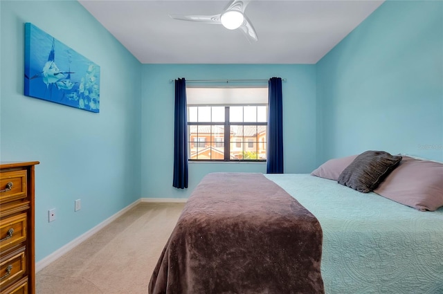 bedroom with light colored carpet and ceiling fan