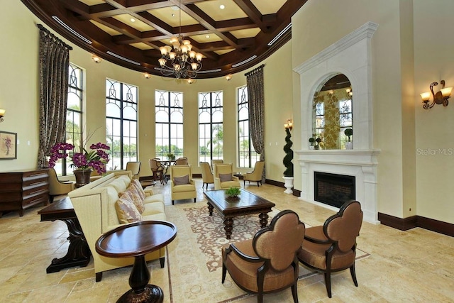 living area featuring beamed ceiling, a towering ceiling, coffered ceiling, and a notable chandelier