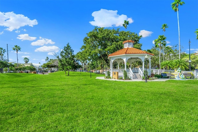 view of property's community with a gazebo and a yard