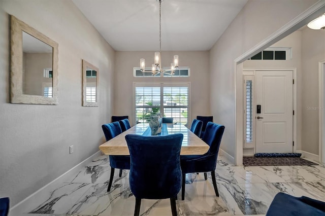 dining space with a chandelier