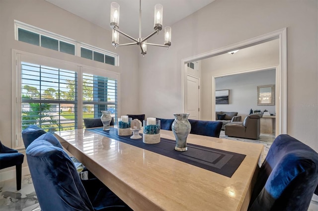 dining space with an inviting chandelier