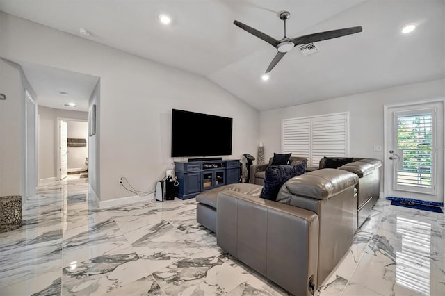 living room featuring ceiling fan and vaulted ceiling