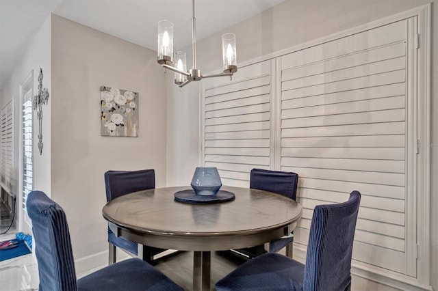 dining space featuring a notable chandelier