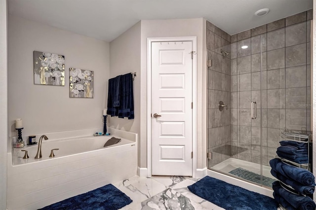 bathroom with shower with separate bathtub