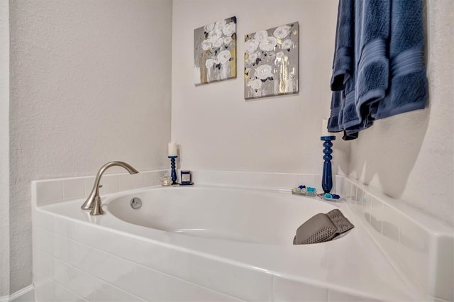 bathroom with a tub to relax in