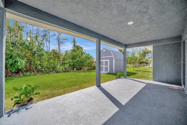 view of patio / terrace with a shed