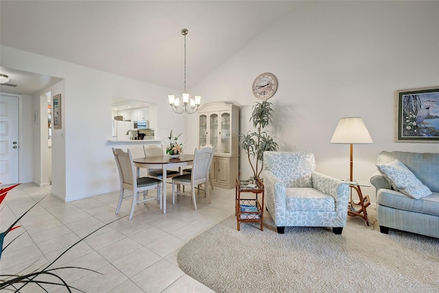 tiled dining space with a chandelier and lofted ceiling