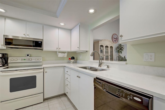 kitchen with white cabinets, white electric range, sink, and dishwasher