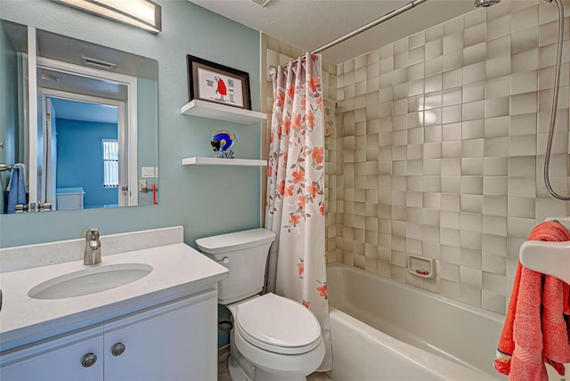 full bathroom featuring vanity, shower / bath combo with shower curtain, and toilet