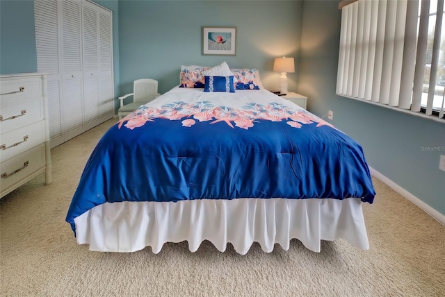 carpeted bedroom featuring a closet