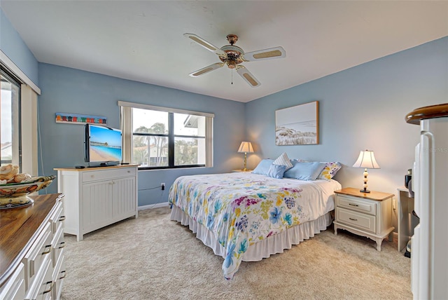 bedroom with light colored carpet and ceiling fan