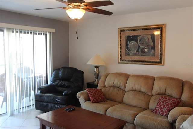 tiled living room with ceiling fan