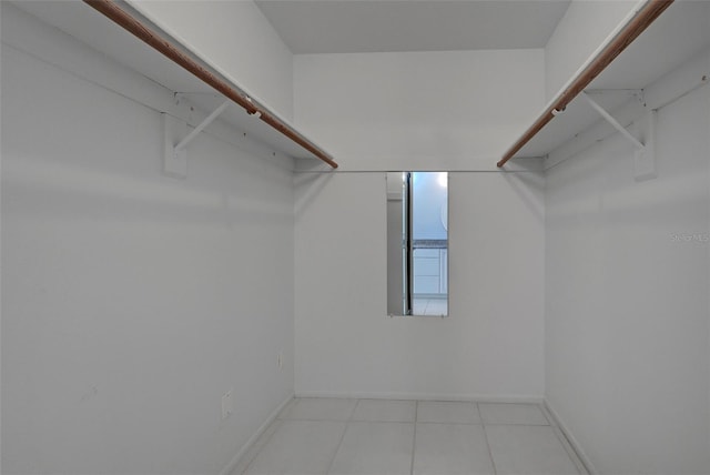 walk in closet featuring light tile patterned floors