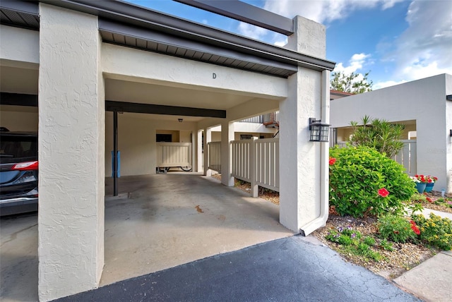 garage featuring a carport