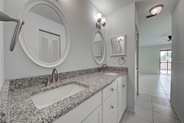 bathroom with ceiling fan, tile patterned floors, and vanity