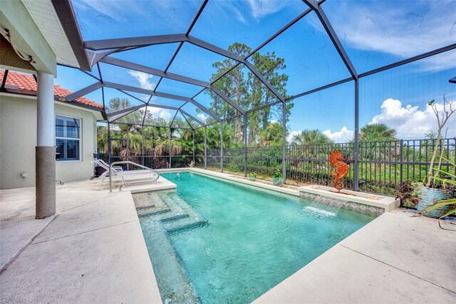 view of pool featuring a patio, a lanai, and pool water feature