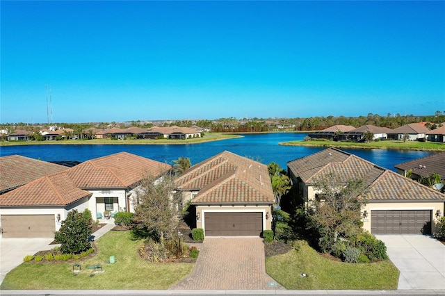 birds eye view of property with a water view