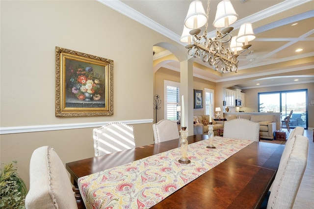 dining area featuring coffered ceiling, ornamental molding, and a chandelier