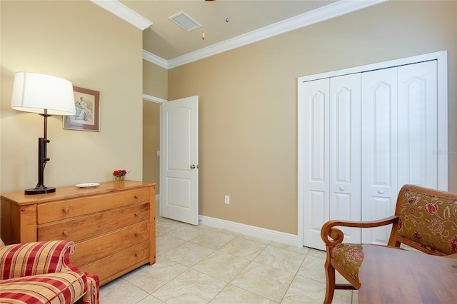 sitting room with ornamental molding and light tile patterned floors