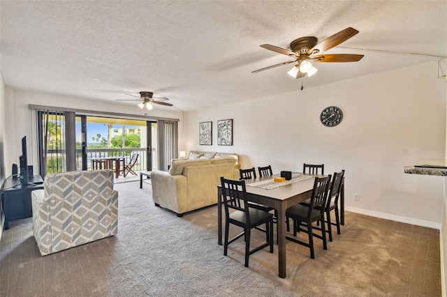 carpeted dining space featuring ceiling fan and a textured ceiling