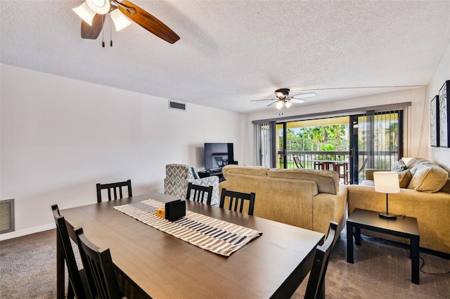 dining room with ceiling fan and a textured ceiling